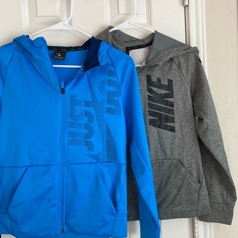 Nike Boys lightweight hooded zip up jackets. Size boy large. Quantity 2